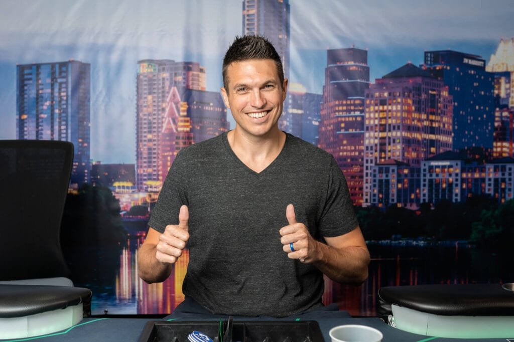 Doug Polk smiling with both thumbs up